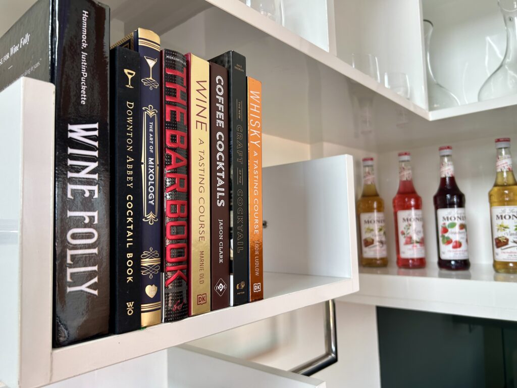 wine books and cocktail recipes at the private bar in The Loftwood Pattaya vacation rental